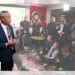 Reform leader Nigel Farage in a room full of journalists