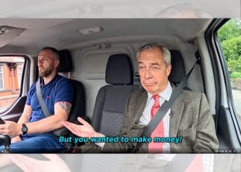 Nigel Farage and Robert Kenyon, both of Reform, sat in the front seats of a van