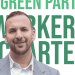 Zack Polanski smiling in front of the new Worker's Charter leaflet