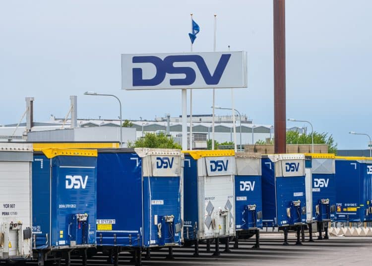 A sign for DSV logistics above a row of DSV trailers Palestine Action Global