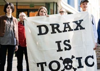 Axe Drax activists hold a banner saying Drax Is Toxic