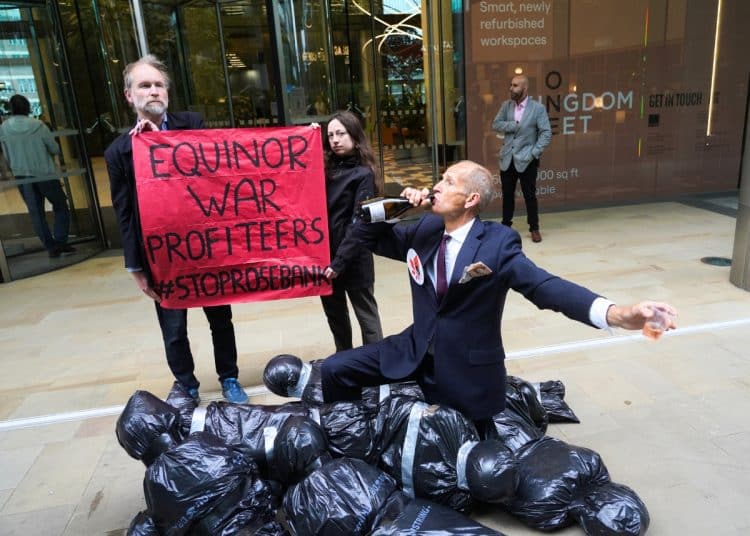 'Body bags' and an 'oil executive' outside the office of Equinor. A banner says Equinor War Profiteers #StopRosebank
