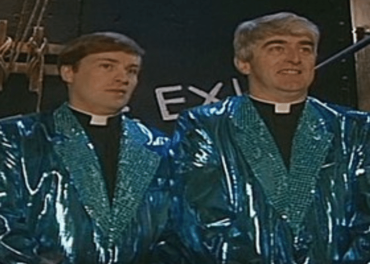 Fathers Ted and Dougal wear garish sparkly blazers over their black robes for Eurovision