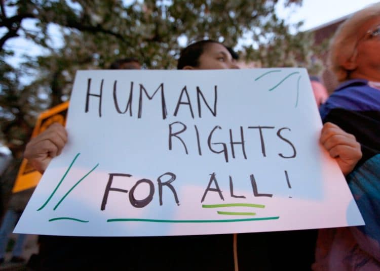 Protest placard reading Human Rights For All