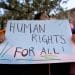 Protest placard reading Human Rights For All