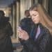 A girl looks at a mobile phone Online misogyny Barnardo's
