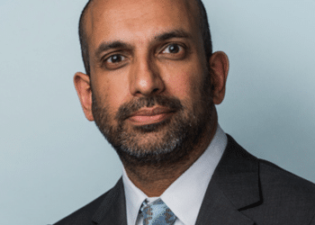A corporate head shot of Palestine Action barrister, Rajiv Menon