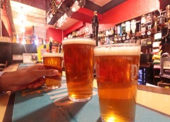 Pint glasses on a bar