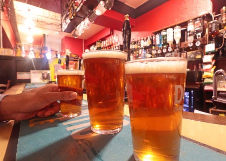 Pint glasses on a bar
