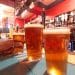 Pint glasses on a bar