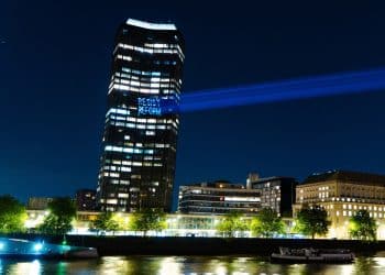 Projection onto Millbank Tower reading Resist Reform