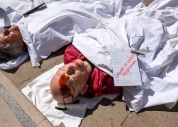 Christian Climate Action protesters stage a die-in at the Treasury over Rosebank