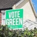 Placard in front of house saying Vote Green