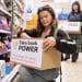 Take Back Power supporters in a shop