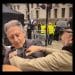 a man grabs Peter Tatchell at the Rally Against Antisemitism