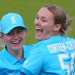 Tilly Corteen-Colemnan taking wickets and laughing during a game with a team mate