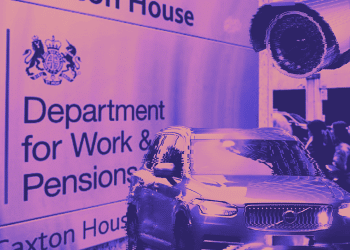 DWP sign at Caxton House in the background. A Volvo car and CCTV camera in the foreground top and bottom right of the image.