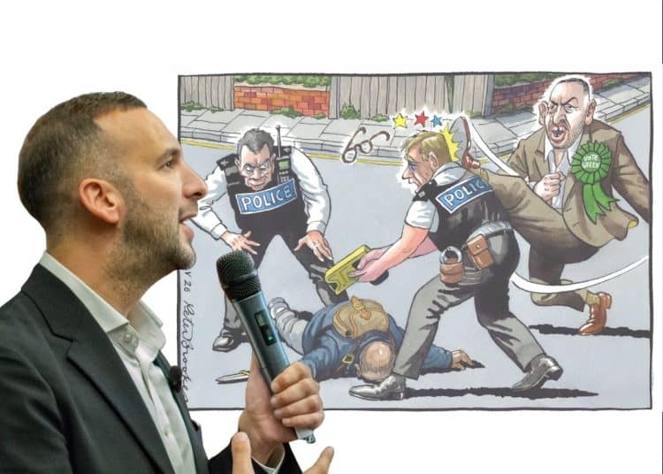 Zack Polanski in front of an antisemitic cartoon