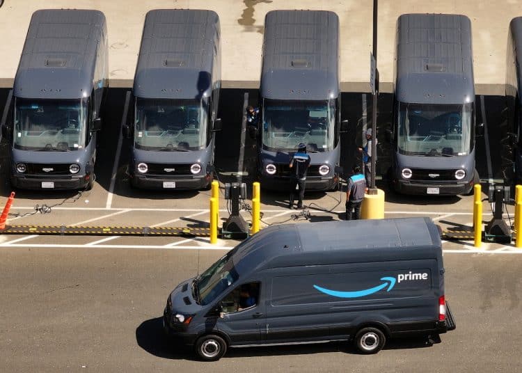 RICHMOND, CALIFORNIA - JULY 16: In an aerial view, an Amazon delivery truck leaves an Amazon distribution center on July 16, 2024 in Richmond, California. As the annual Amazon Prime Day is underway, the U.S. Senate’s Health, Education, Labor and Pensions (HELP) Committee has made public early results of an investigation into working conditions at Amazon warehouses that reveal that Prime Day is a major cause of worker injuries. The committee received internal data from Amazon that showed total injuries on Prime Day 2019 were nearly 45 injuries per 100 workers. (Photo by Justin Sullivan/Getty Images)