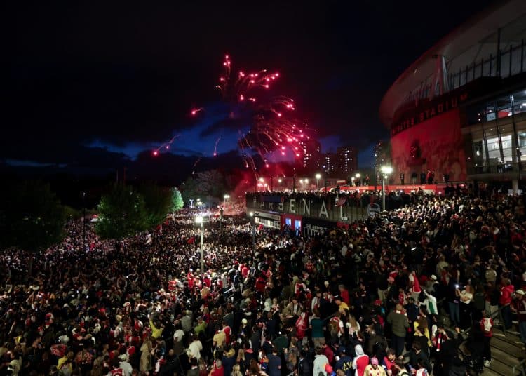 LONDON, ENGLAND - MAY 19: A general view as fans of Arsenal celebrate as Arsenal are confirmed as Premier League champions following Manchester City's 1-1 draw against AFC Bournemouth, as they gather outside the Emirates Stadium, on May 19, 2026 in London, England. (Photo by Julian Finney/Getty Images)