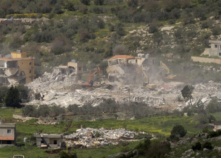 ISRAELI-LEBANON BORDER - APRIL 12: Israeli bulldozers demolish houses in Southern Lebanon, as seen from a position on the Israeli side of the border on April 12, 2026 in Southern Lebanon. Israel stepped-up its attacks on Lebanon following President Donald Trump's announcement of a two-week ceasefire agreement between the US and Iran. Israel says it will observe the ceasefire with Iran but insists Lebanon was not included in the deal, and on April 8 launched the "largest coordinated strike" on Hezbollah targets since the resumption of the cross-border war on March 2, killing more than 200 people. Iran and Pakistan - which has been coordinating peace talks - have said that the ceasefire included Lebanon, while US President Donald Trump has said Lebanon is a "separate skirmish," and not part of the deal. (Photo by Amir Levy/Getty Images)