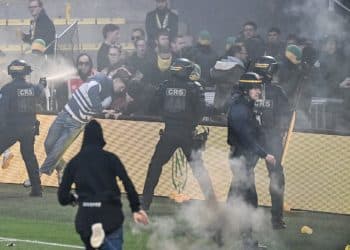 French League match cancelled after fans storm pitch