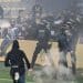 French League match cancelled after fans storm pitch