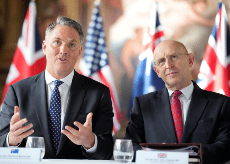 (L-R) Australian Defence Minister Richard Marles and UK Defense Secretary John Healey sit together for the AUKUS Defence Ministers Meeting at Old Royal Naval College on September 26, 2024 in London, England.