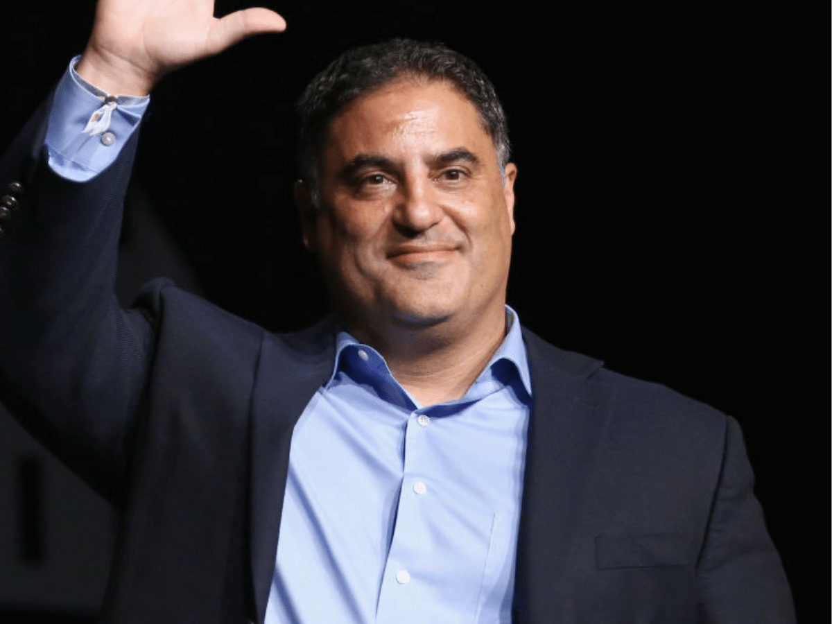 Cenk Uygur waves at a crowd. He was interviewed on LBC with Shelagh Fogarty on 3 June 2026