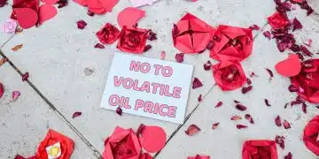 Christian Climate Action against Rosebank with paper roses and a message saying No To Volatile Oil Price