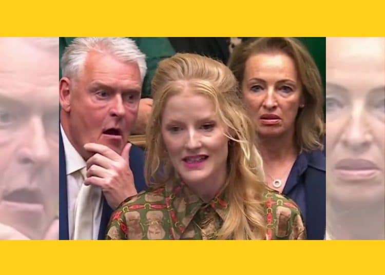 Lee Anderson and Sarah Pochin of Reform UK staring at Hannah Spencer