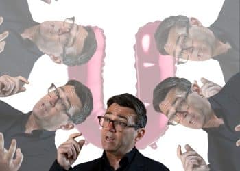 Images of Andy Burnham in front of a big U (Waspi women)