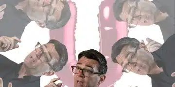 Images of Andy Burnham in front of a big U (Waspi women)