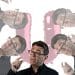 Images of Andy Burnham in front of a big U (Waspi women)