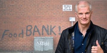 Al Carns in front of a food bank