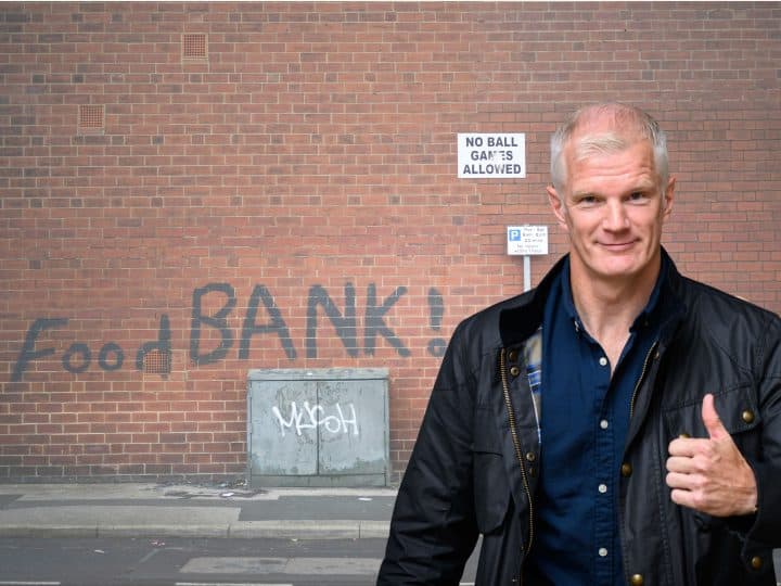 Al Carns in front of a food bank