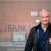 Al Carns in front of a food bank
