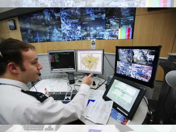 A police officer in front of computers, AI use