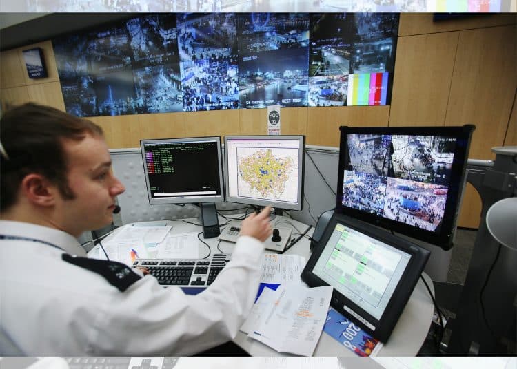 A police officer in front of computers, AI use