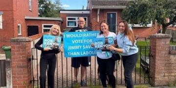 Reform councillors standing next to a man holding a sign which reads 'I would rather vote for Jimmy Saville than Labour'