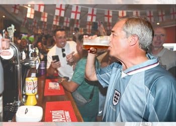Nigel Farage drinking a pint in 2024