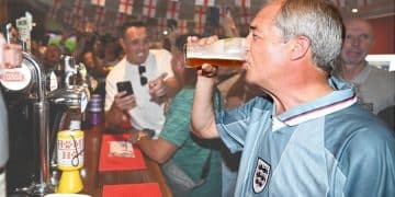 Nigel Farage drinking a pint in 2024