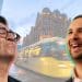 Andy Burnham and Zack Polanski in front of an image of Manchester
