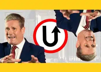 Keir Starmer in front of a U-turn sign