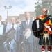 Reform UK candidate Andy Curwen, dressed in his regalier, and in the background, another image of Nigel Farage and other Reform members