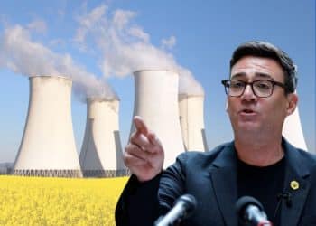 Andy Burnham in front of a power plant
