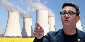 Andy Burnham in front of a power plant
