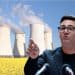 Andy Burnham in front of a power plant