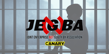 In the backgrounds is an image of a child in prison. It is the silhouette of a child facing left and they have their knees up to their chest. In the forefront is the JENGbA logo and underneath is the Canary UK logo