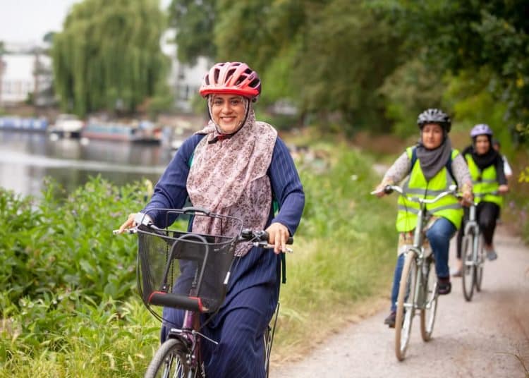 Women cycling along a towpath